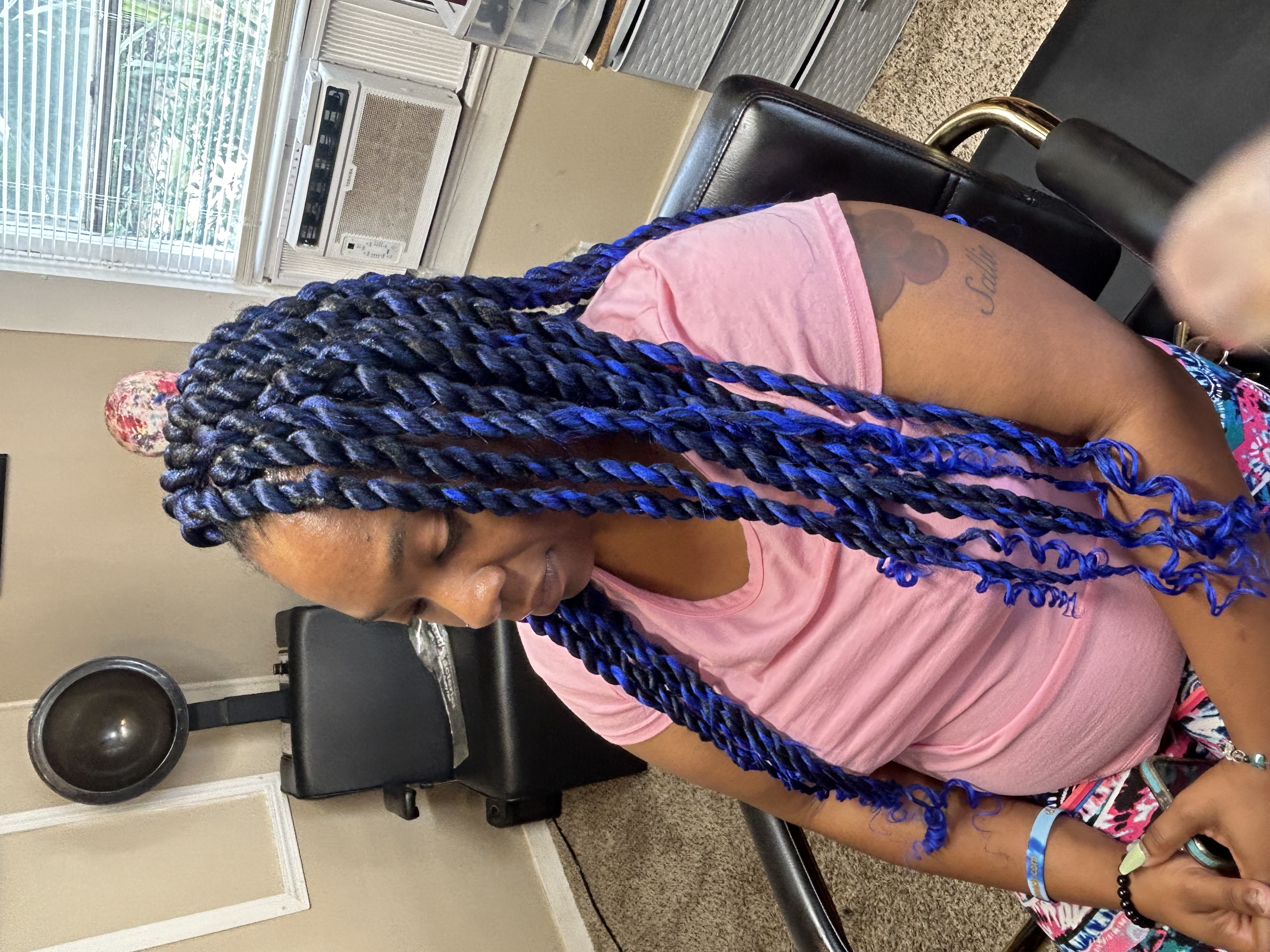 Blue twist braids with curly ends